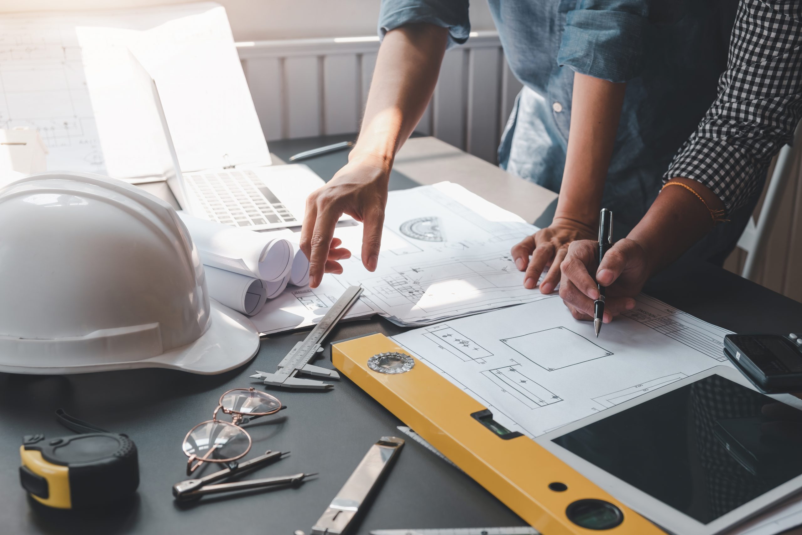 Permitting Blueprint Plans being reviewed in the office